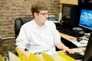 Ryan Adkins working at his computer