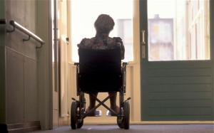 woman in a wheelchair sitting in a doorway