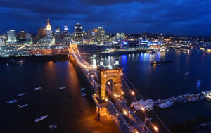 Cincinnati skyline and bridge lit up at night time